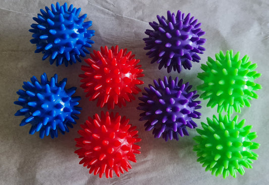 Image. Acupressure balls. Blue, red, purple, green.