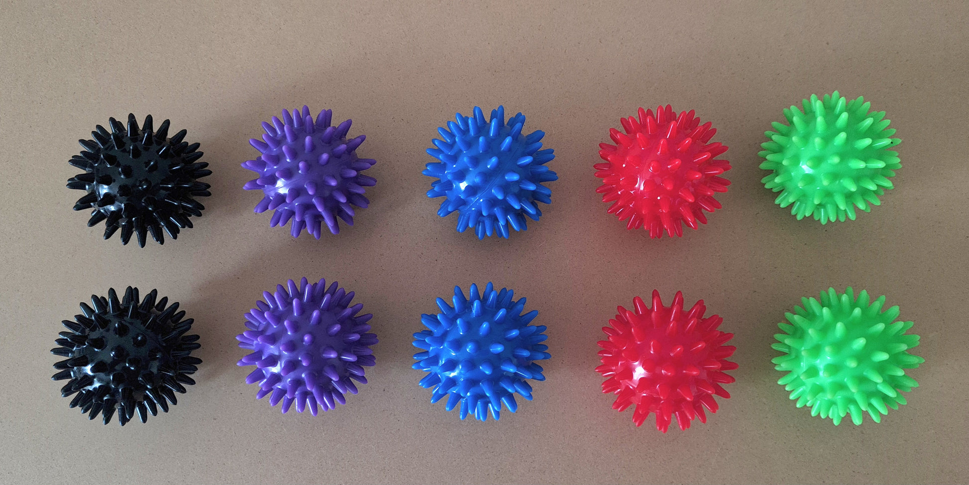 Image. Acupressure massage balls. Various colours Black, green, blue, red, purple . 6cm diameter. PVC. Use in pregnancy and labour to aid pain relief and muscle relaxation.