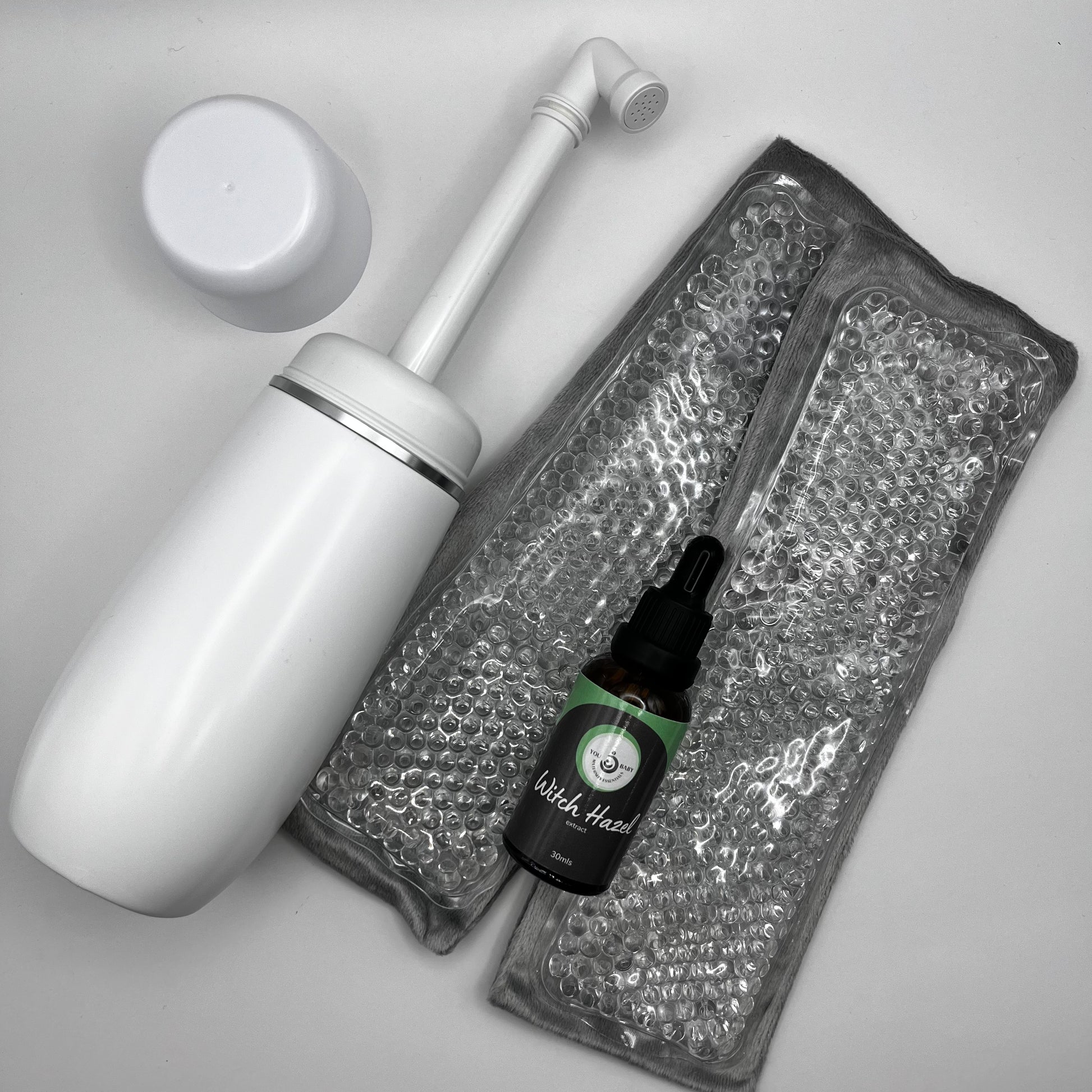 Cleaning tool with a bottle of liquid on a gray background
