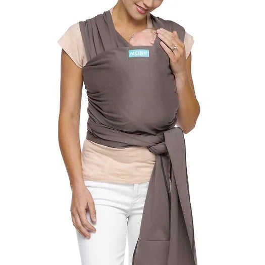 Image. The versatile MOBY Wrap offers multiple carrying positions as baby grows, plus one-size-fits-all comfort for parents and caregivers 